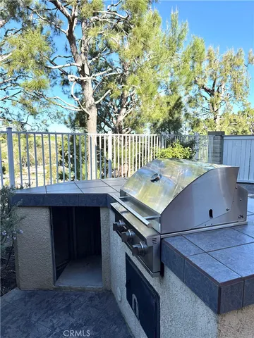 a view of a room with a window and wooden fence