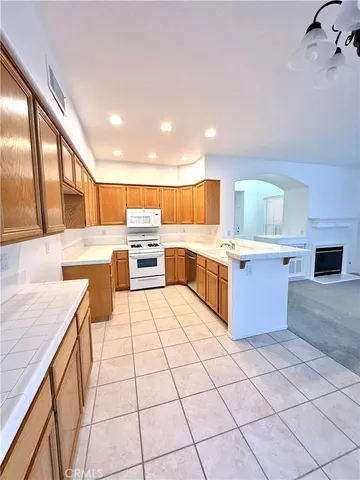 a kitchen with stainless steel appliances a sink and counter space
