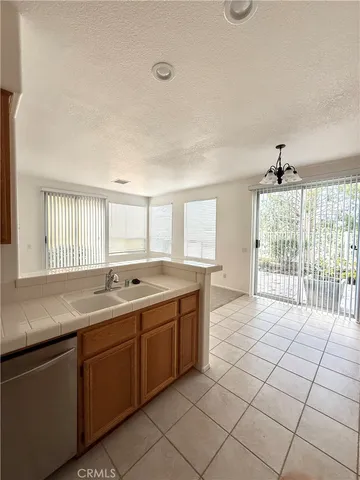 a spacious bathroom with a granite countertop sink and mirror