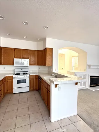 a kitchen with stainless steel appliances a stove sink and cabinets