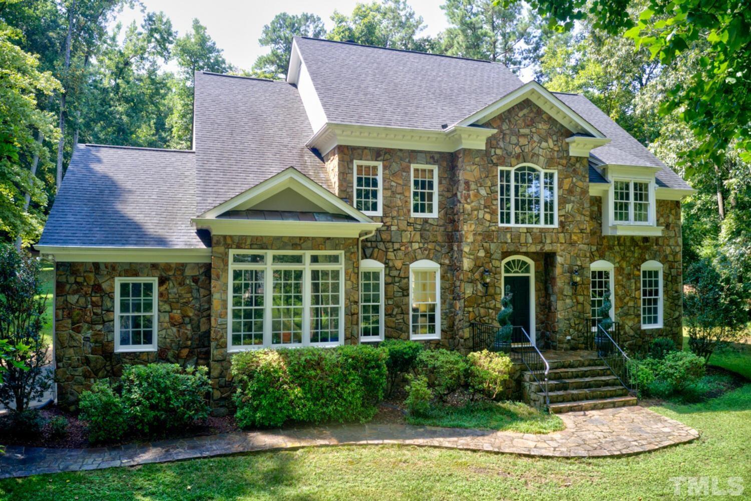 2021 Rolling Rock Road Wake Forest, NC 27587 - Photo 1 of 27 a front view of a house with garden