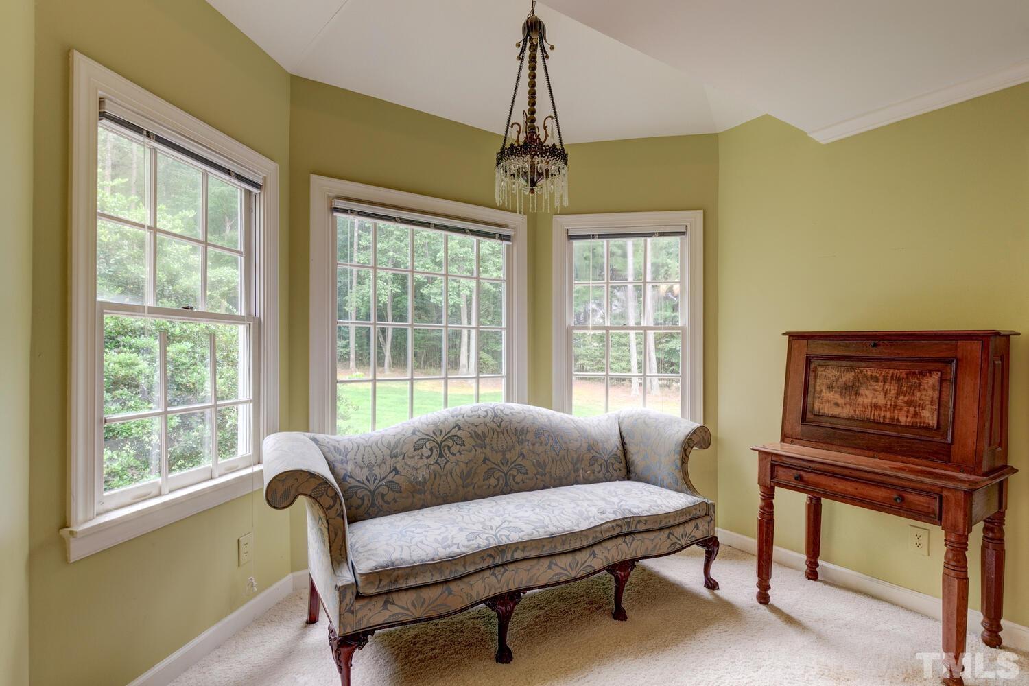 2021 Rolling Rock Road Wake Forest, NC 27587 - Photo 22 of 27 a living room with furniture and a window
