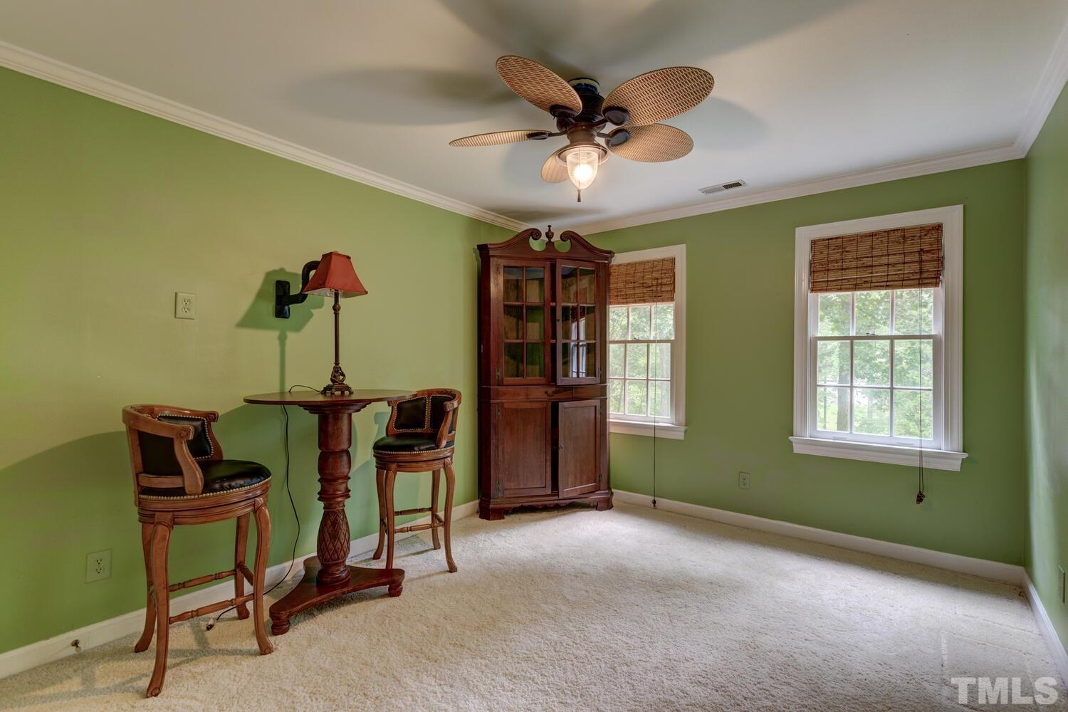 2021 Rolling Rock Road Wake Forest, NC 27587 - Photo 23 of 27 a living room with furniture and a window