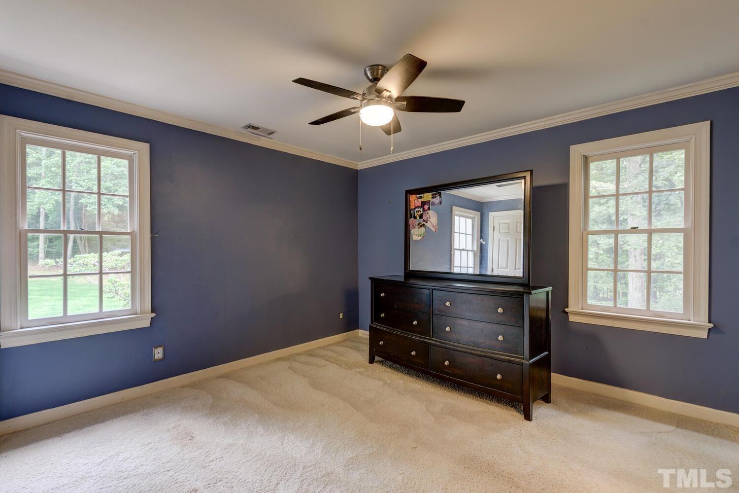 2021 Rolling Rock Road Wake Forest, NC 27587 - Photo 25 of 27 a room with window and dresser
