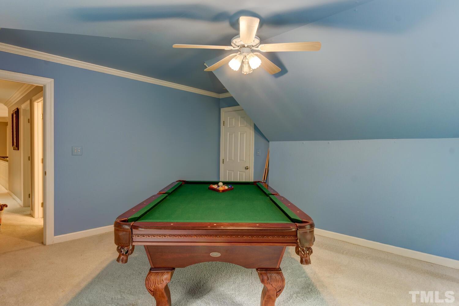 2021 Rolling Rock Road Wake Forest, NC 27587 - Photo 27 of 27 a room with pool table and chandelier