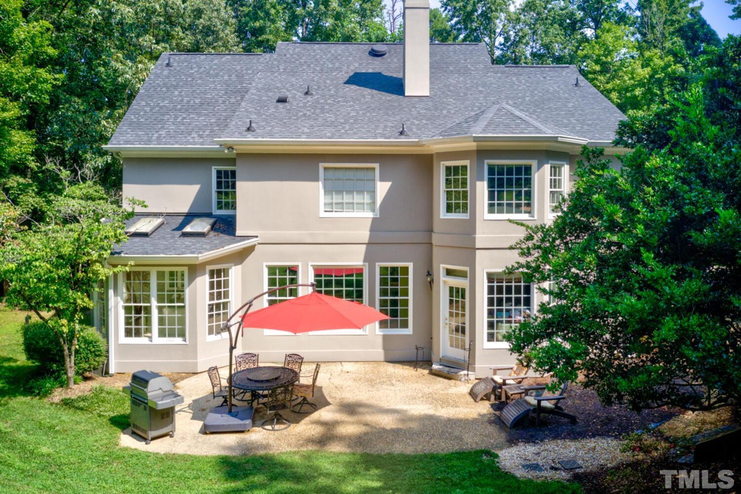 2021 Rolling Rock Road Wake Forest, NC 27587 - Photo 4 of 27 a front view of a house with a yard and outdoor seating