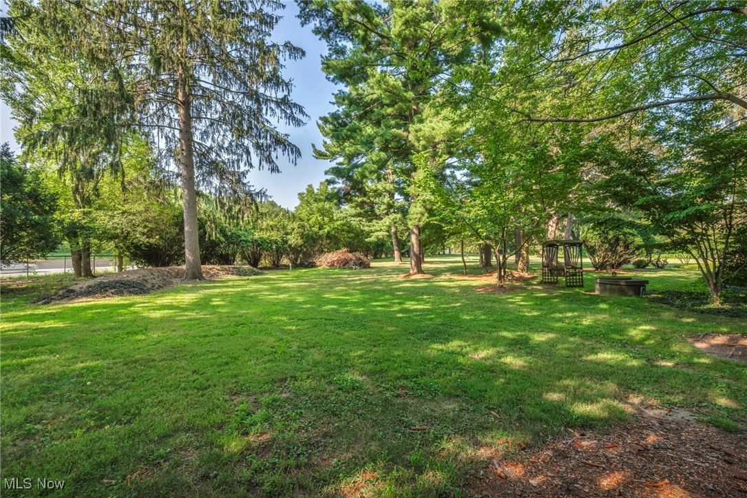 25915 Kennedy Ridge Road North Olmsted, OH 44070 - Photo 44 of 48 View of green lawn featuring view of scattered trees