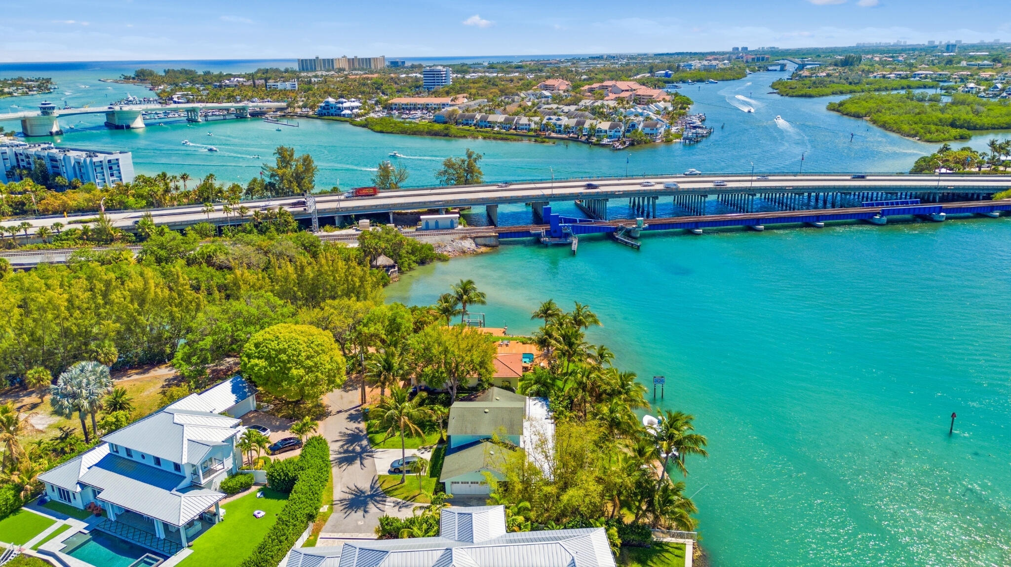 1305 Peninsular Road Jupiter, FL 33469 - Photo 14 of 23 an aerial view of a house with a garden and lake view