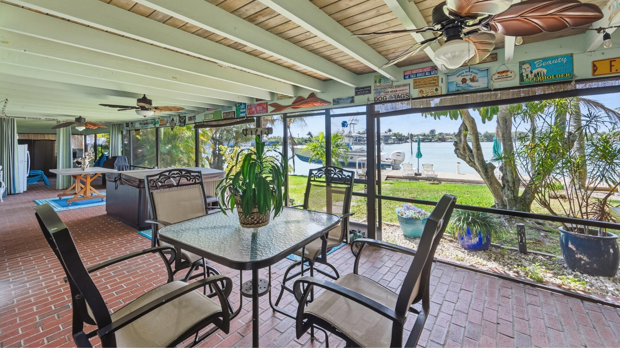 1305 Peninsular Road Jupiter, FL 33469 - Photo 18 of 23 a view of a dining room with furniture large windows and wooden floor
