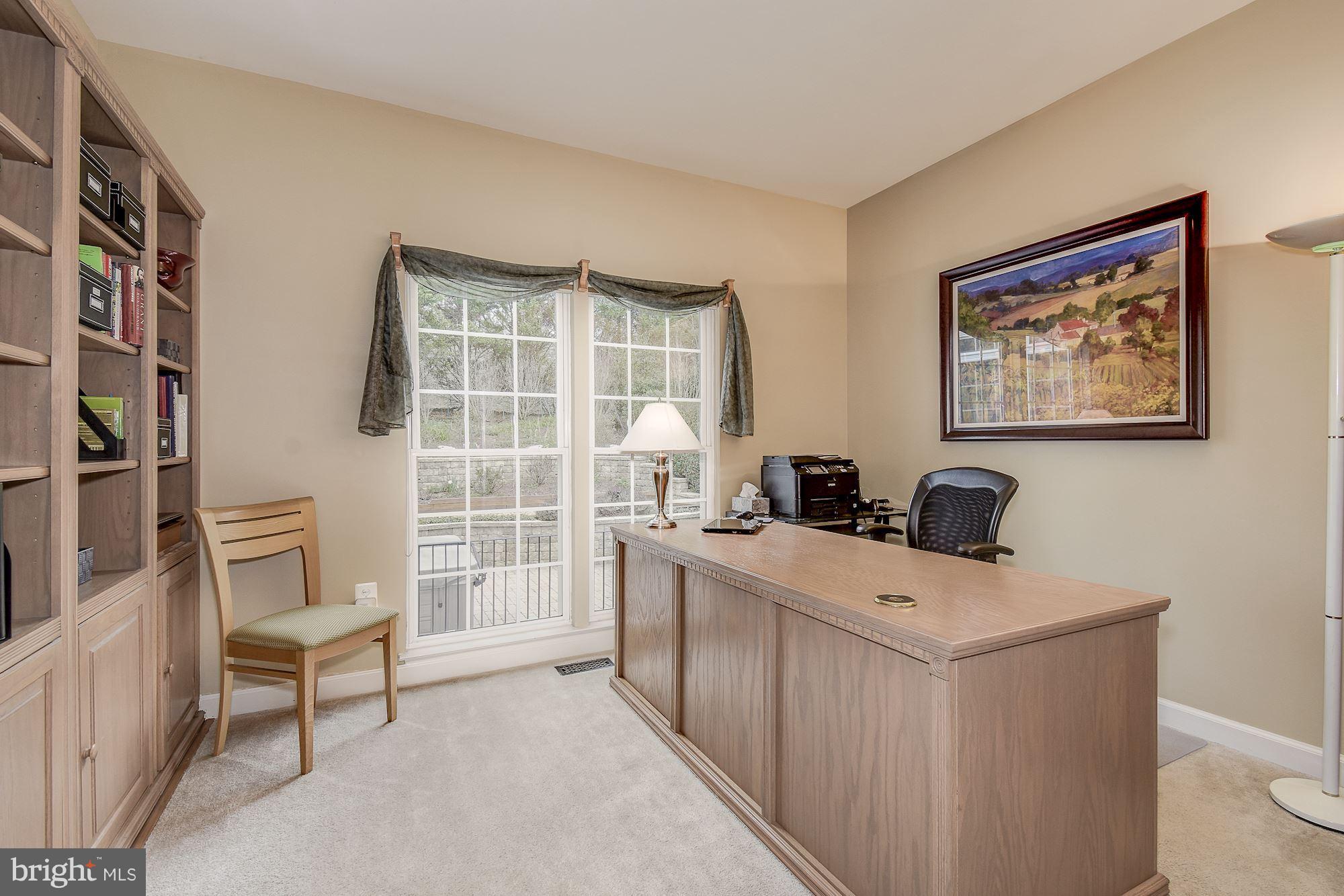 8639 Hillside Manor Drive Springfield, VA 22152 - Photo 12 of 30 a view of a workspace with furniture and a window