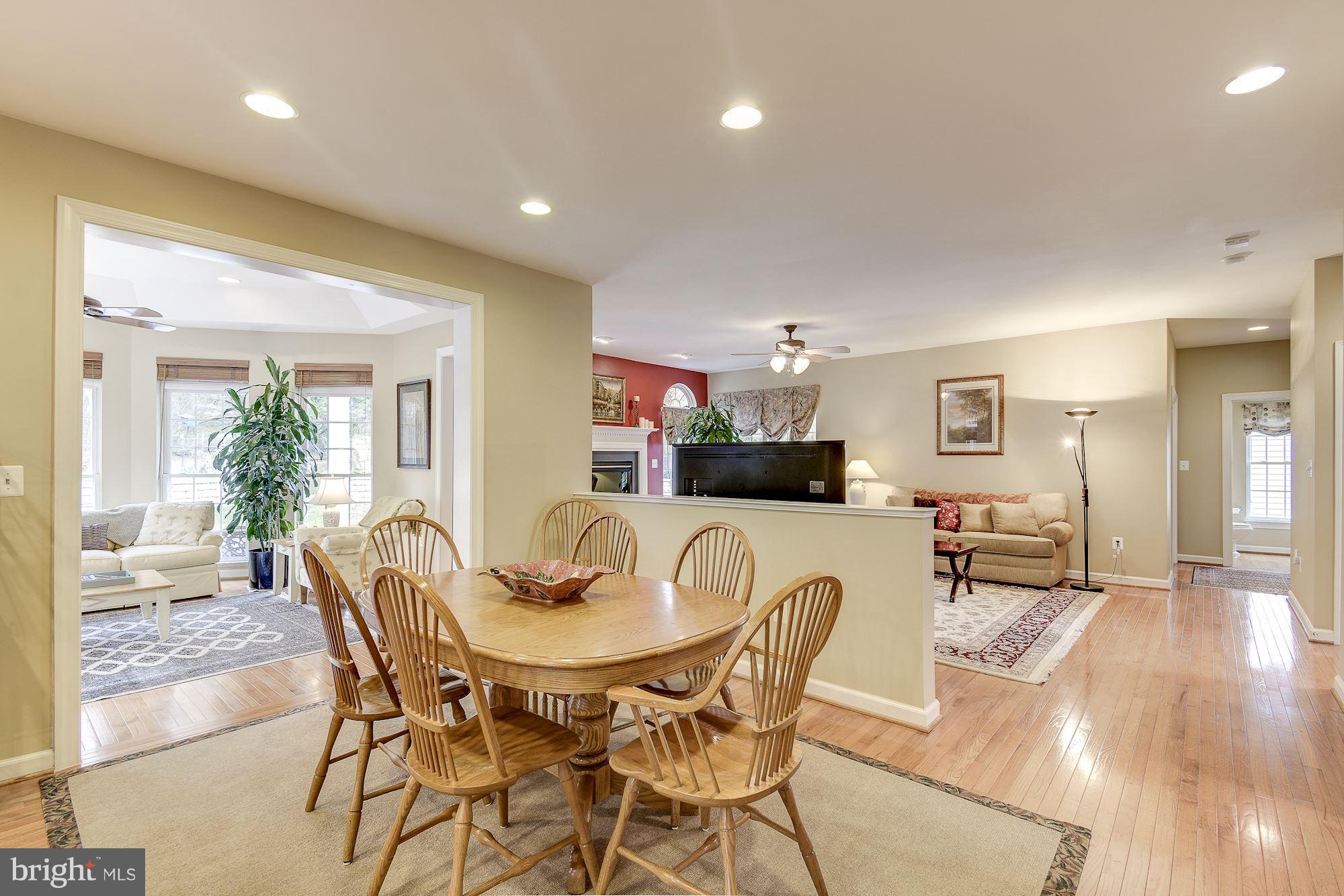 8639 Hillside Manor Drive Springfield, VA 22152 - Photo 30 of 30 a view of a dining room with furniture and wooden floor