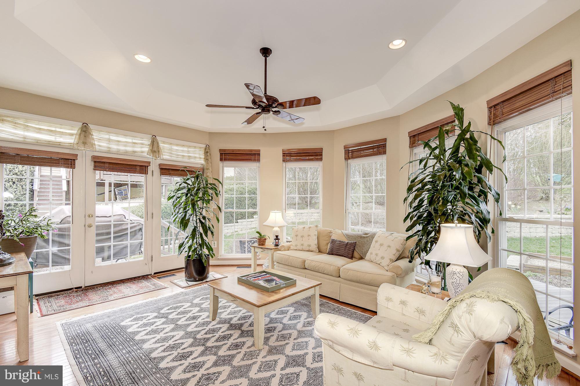 8639 Hillside Manor Drive Springfield, VA 22152 - Photo 14 of 30 a living room with furniture and a large window