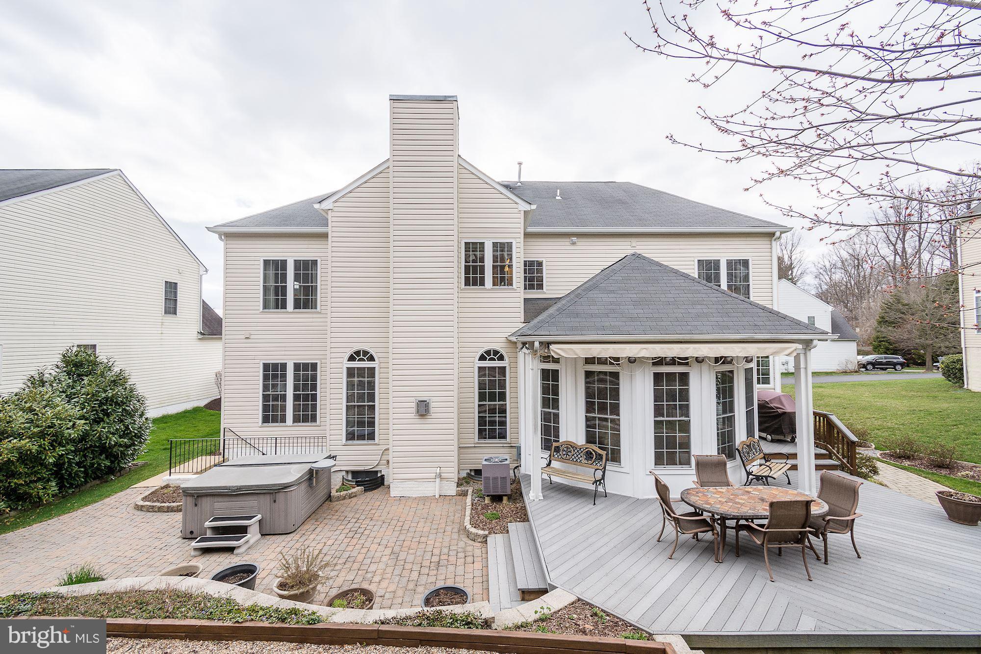 8639 Hillside Manor Drive Springfield, VA 22152 - Photo 6 of 30 a view of a house with backyard sitting area and garden