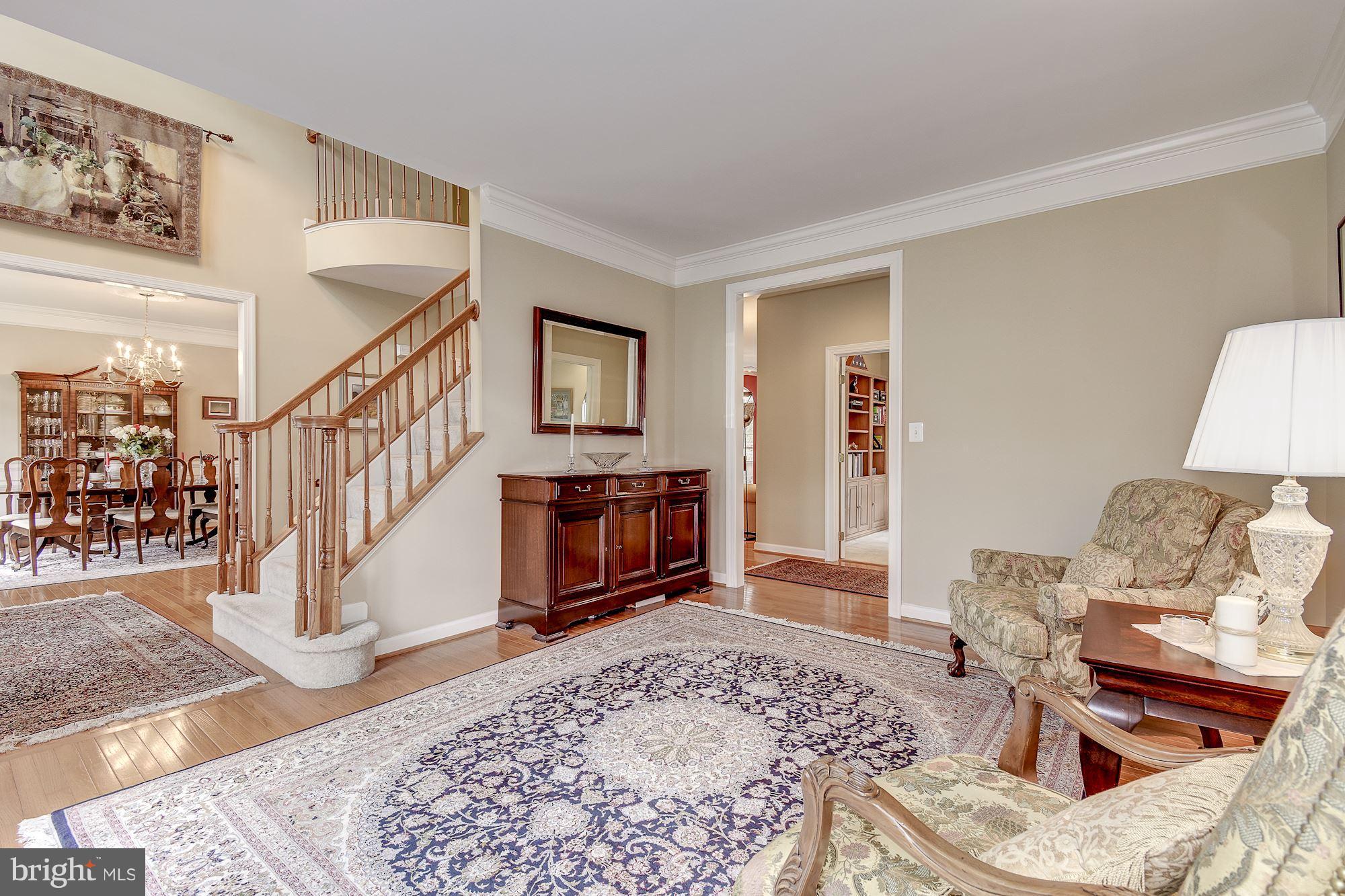 8639 Hillside Manor Drive Springfield, VA 22152 - Photo 8 of 30 a living room with furniture and a fireplace