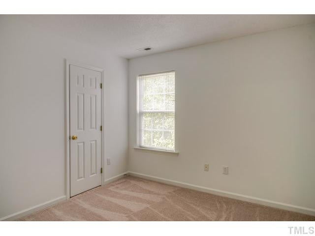 4512 Nightfall Court Durham, NC 27713 - Photo 18 of 24 a view of an empty room and window