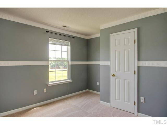 4512 Nightfall Court Durham, NC 27713 - Photo 19 of 24 a view of an empty room with a window