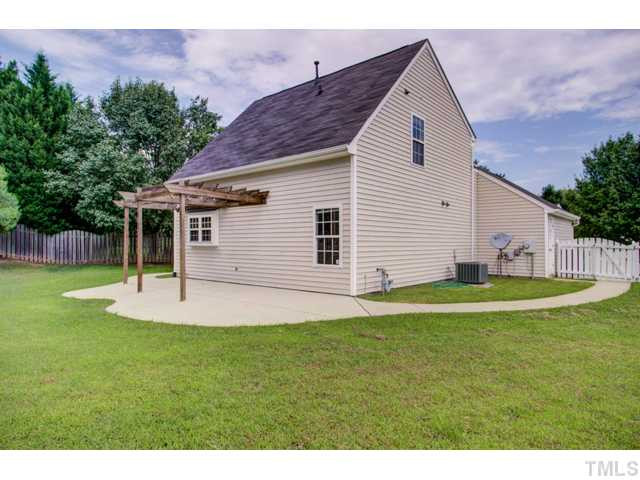 4512 Nightfall Court Durham, NC 27713 - Photo 20 of 24 a backyard of a house with table and chairs