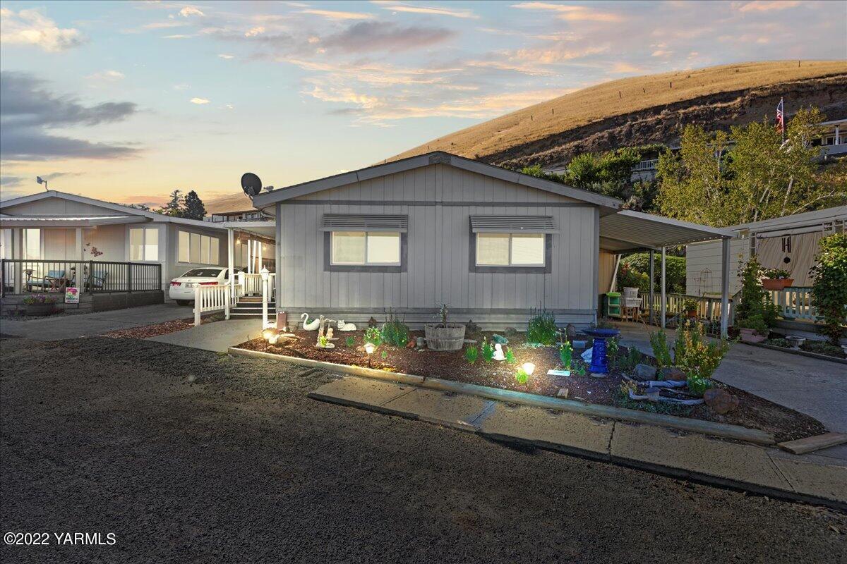 300 Alps Road, Unit 1008 Moxee, WA 98936 - Photo 2 of 22 a view of house with outdoor space and sitting area