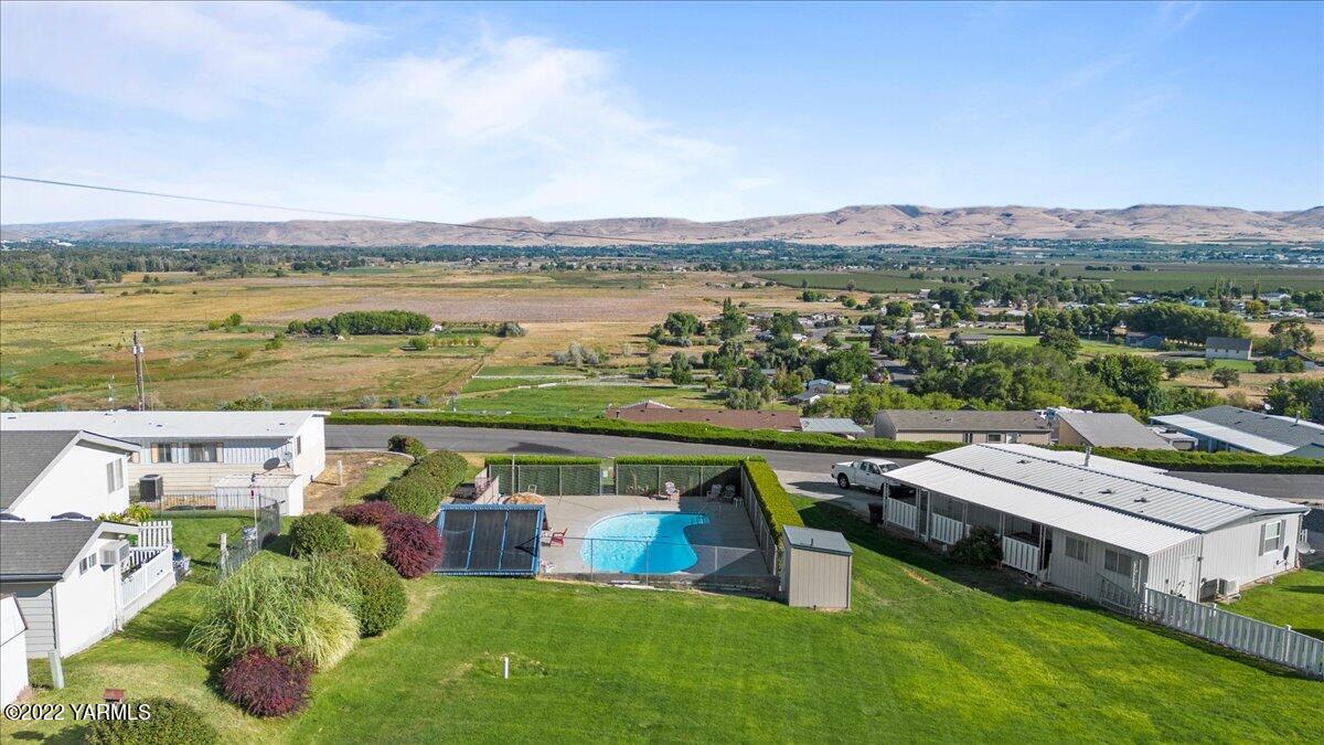 300 Alps Road, Unit 1008 Moxee, WA 98936 - Photo 22 of 22 an aerial view of a house with a garden and lake view