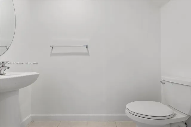 a bathroom with a sink a toilet and vanity