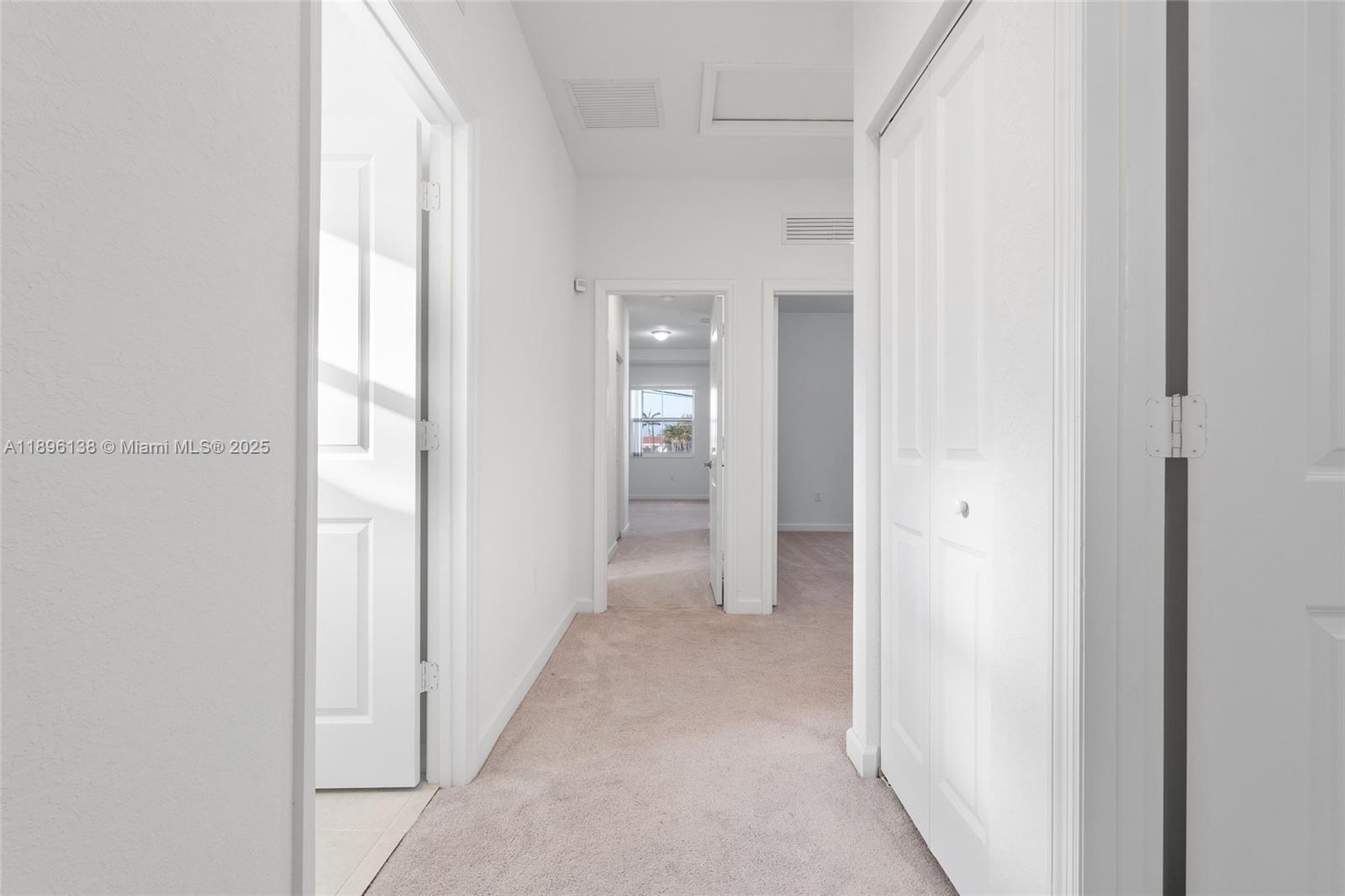 2405 Northwest 131st Street Miami, FL 33167 - Photo 23 of 38 a view of a hallway with wooden floor