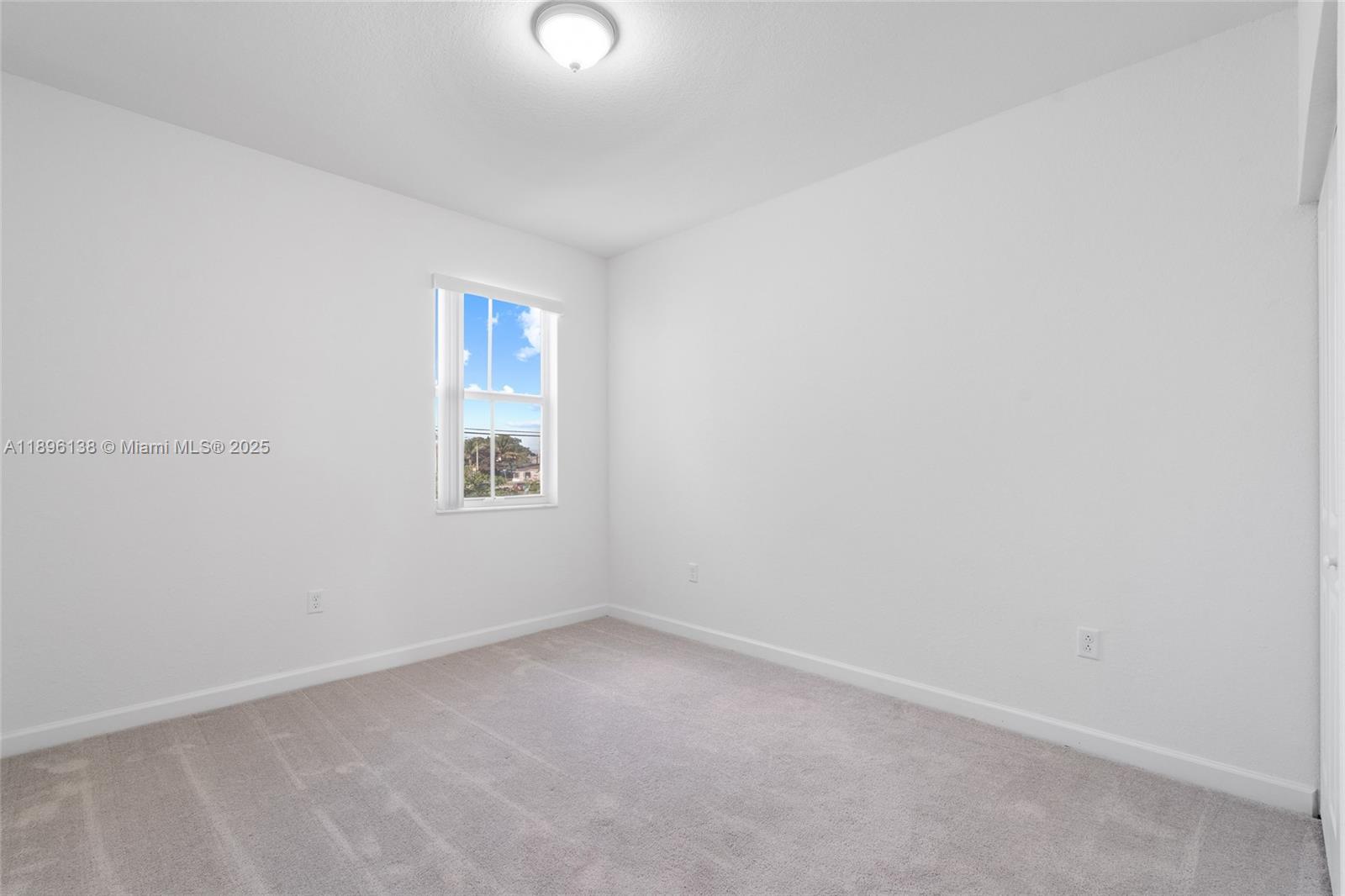 2405 Northwest 131st Street Miami, FL 33167 - Photo 24 of 38 an empty room with a window