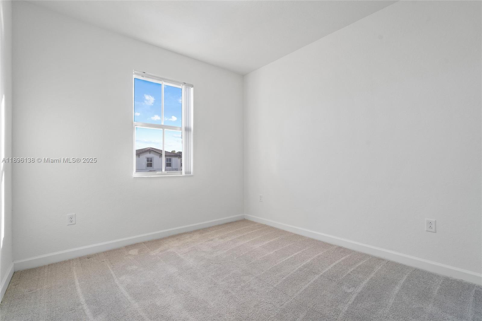 2405 Northwest 131st Street Miami, FL 33167 - Photo 27 of 38 an empty room with windows