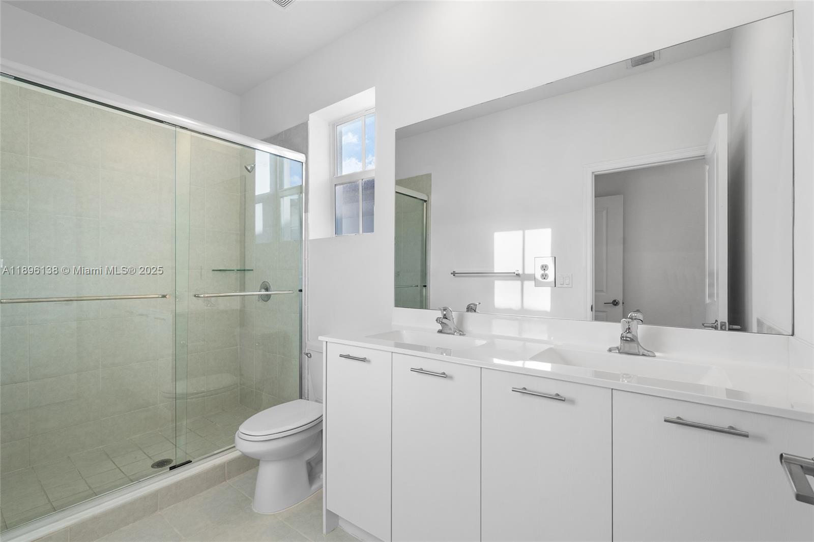 2405 Northwest 131st Street Miami, FL 33167 - Photo 28 of 38 a bathroom with a sink a toilet and shower