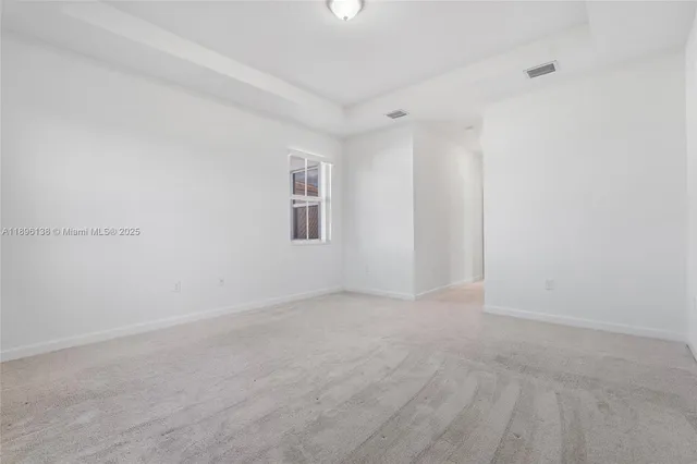 a view of a house with backyard and garden