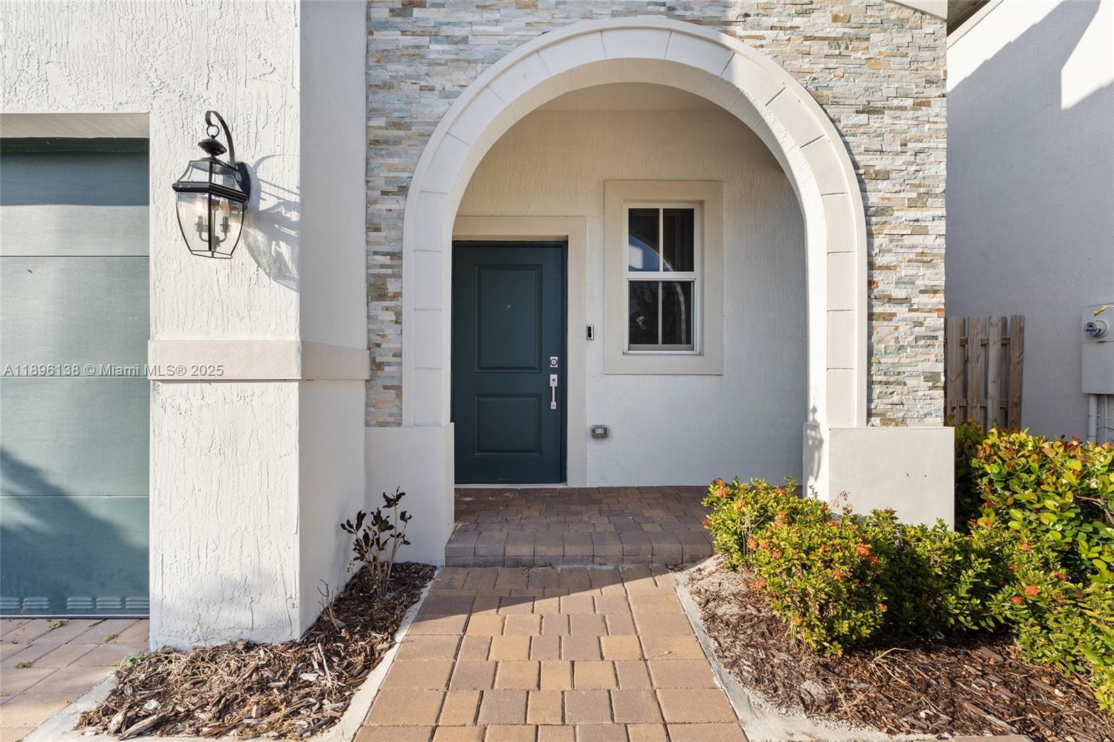 2405 Northwest 131st Street Miami, FL 33167 - Photo 4 of 38 a front view of a house with a yard