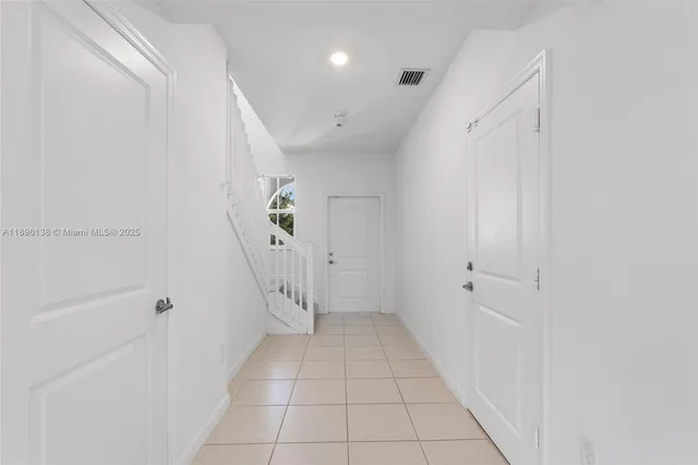 a view of an entryway with white walls