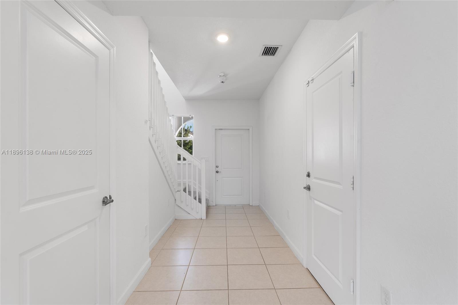 2405 Northwest 131st Street Miami, FL 33167 - Photo 9 of 38 a view of an entryway with white walls