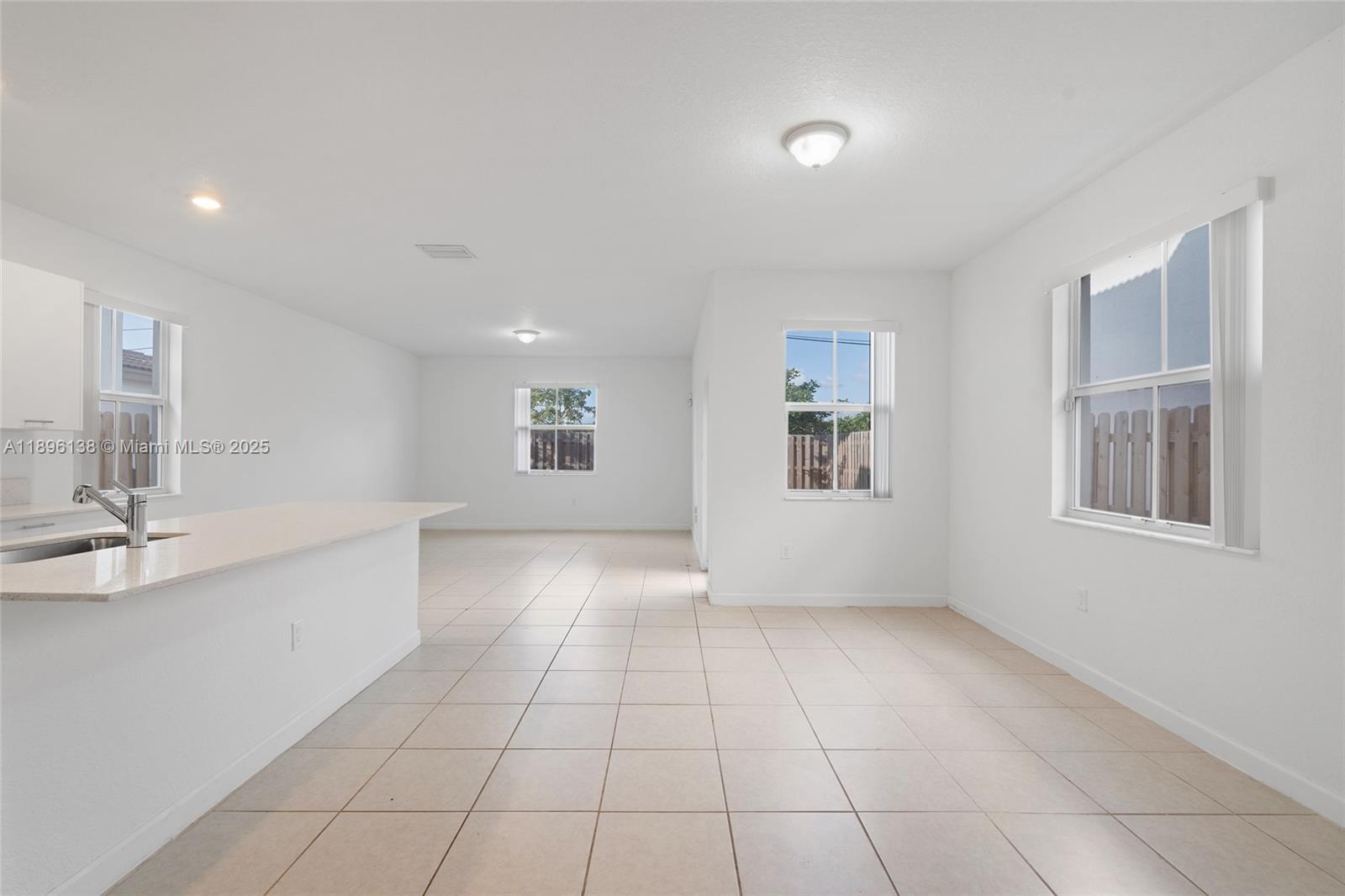 2405 Northwest 131st Street Miami, FL 33167 - Photo 10 of 38 a view of an empty room with a window