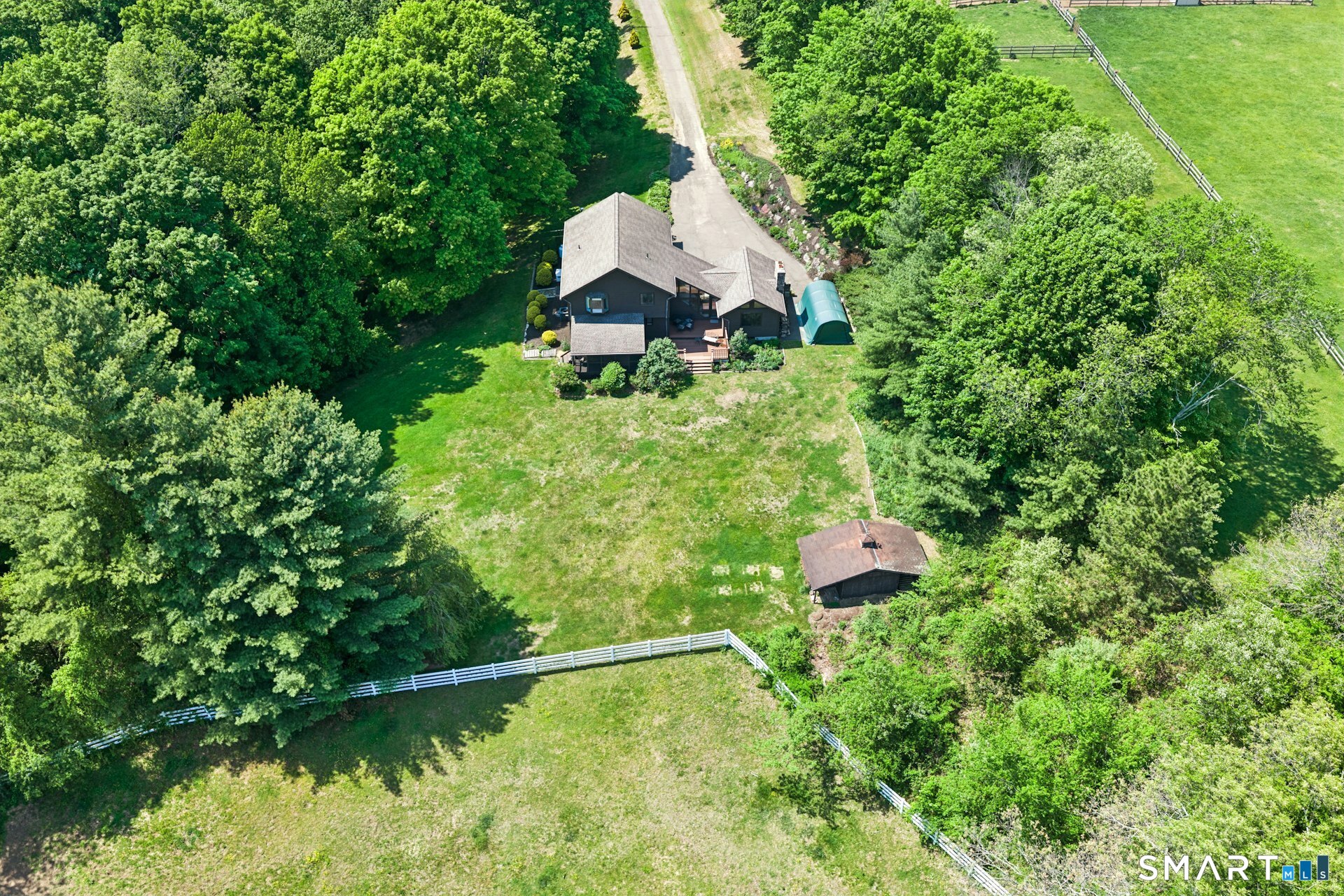 127 Huntingtown Road Newtown, CT 06470 - Photo 33 of 38 a backyard of a house with a yard and outdoor seating
