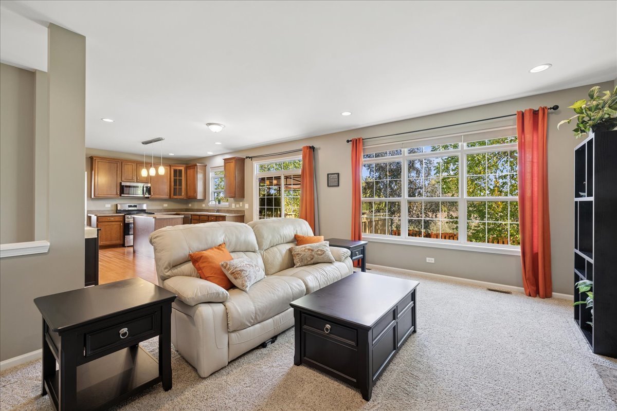 2681 Braeburn Way Woodstock, IL 60098 - Photo 13 of 41 a living room with furniture and a large window