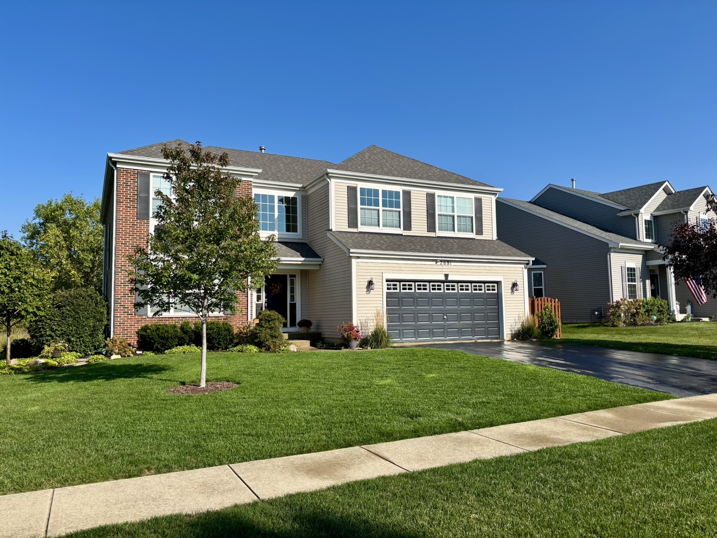 2681 Braeburn Way Woodstock, IL 60098 - Photo 2 of 41 a front view of a house with a yard