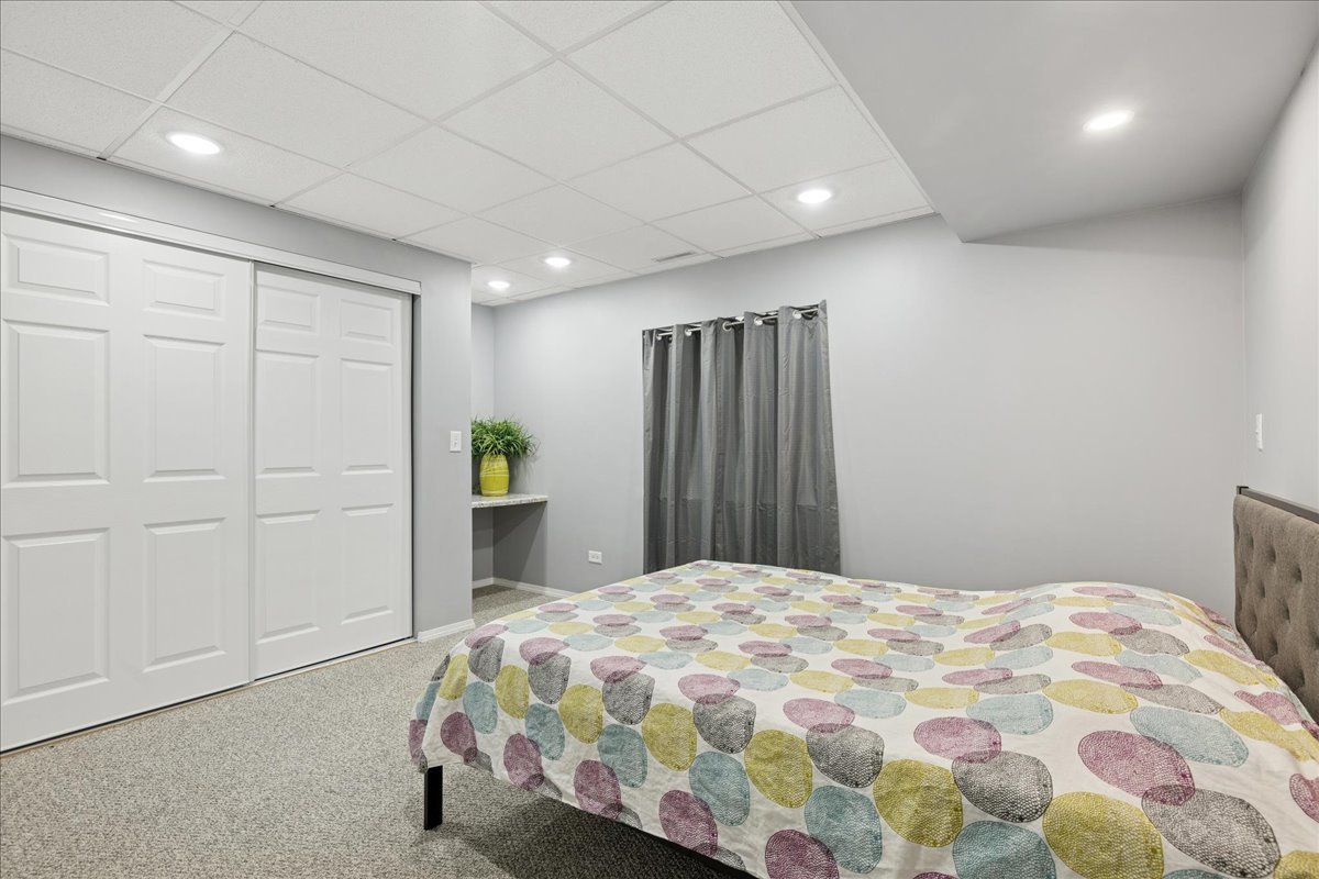 2681 Braeburn Way Woodstock, IL 60098 - Photo 23 of 41 a bedroom with a large bed and a closet