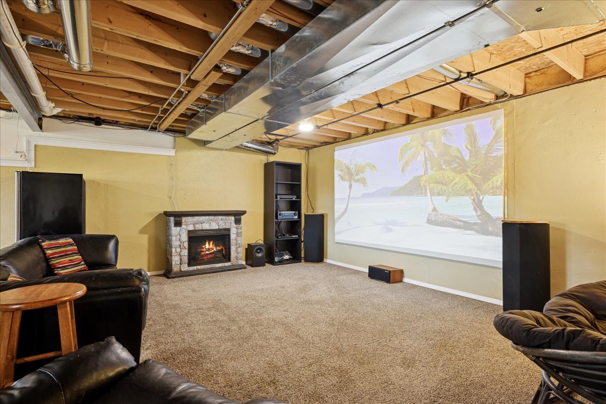 2681 Braeburn Way Woodstock, IL 60098 - Photo 26 of 41 a living room with furniture and a flat screen tv