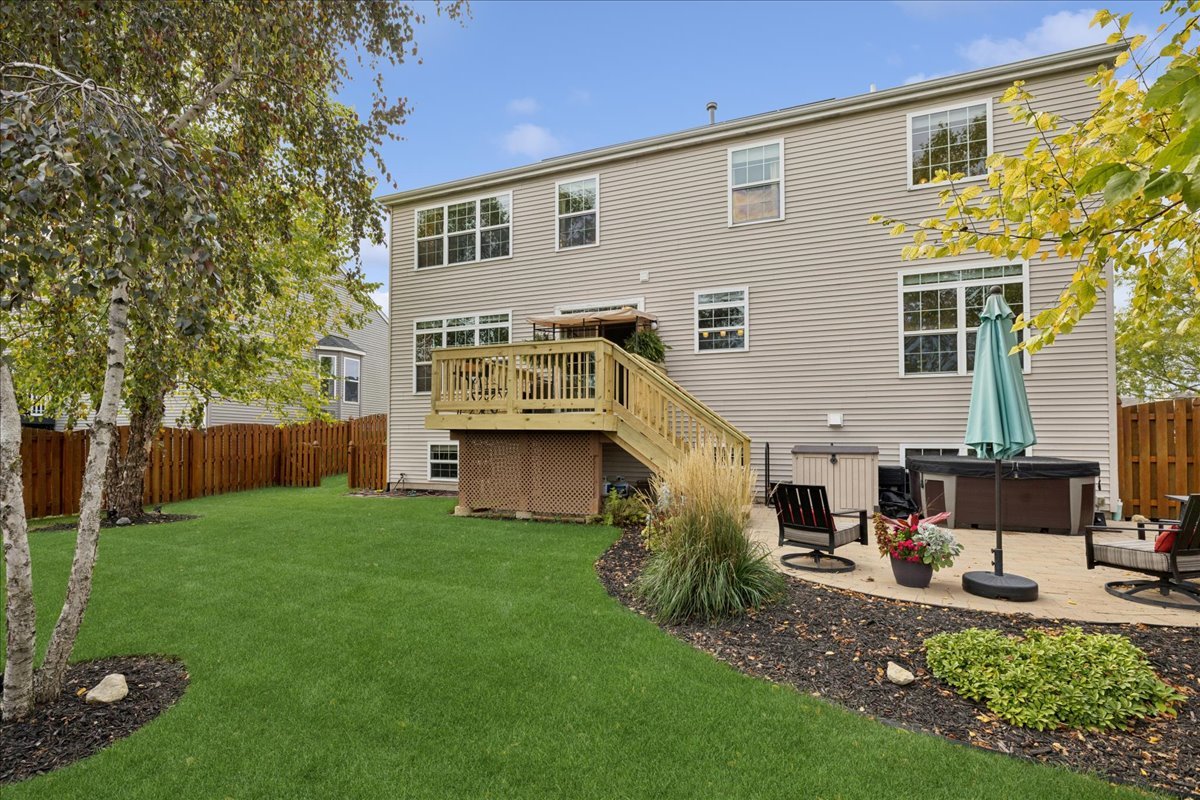 2681 Braeburn Way Woodstock, IL 60098 - Photo 30 of 41 a view of a house with backyard and sitting area