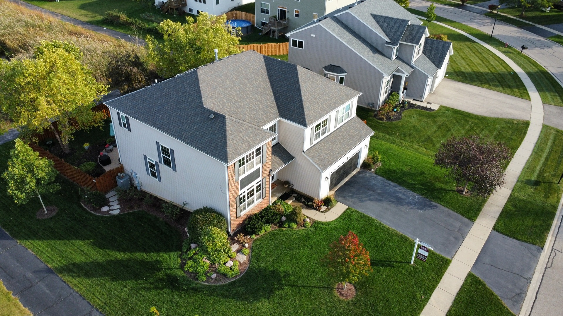 2681 Braeburn Way Woodstock, IL 60098 - Photo 39 of 41 an aerial view of a house with garden space and street view