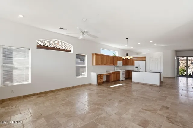 a view of kitchen and kitchen with a stove