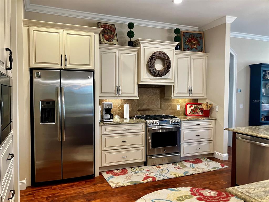 3709 Gallagher Road Plant City, FL 33565 - Photo 19 of 60 a kitchen with a stove top oven and refrigerator