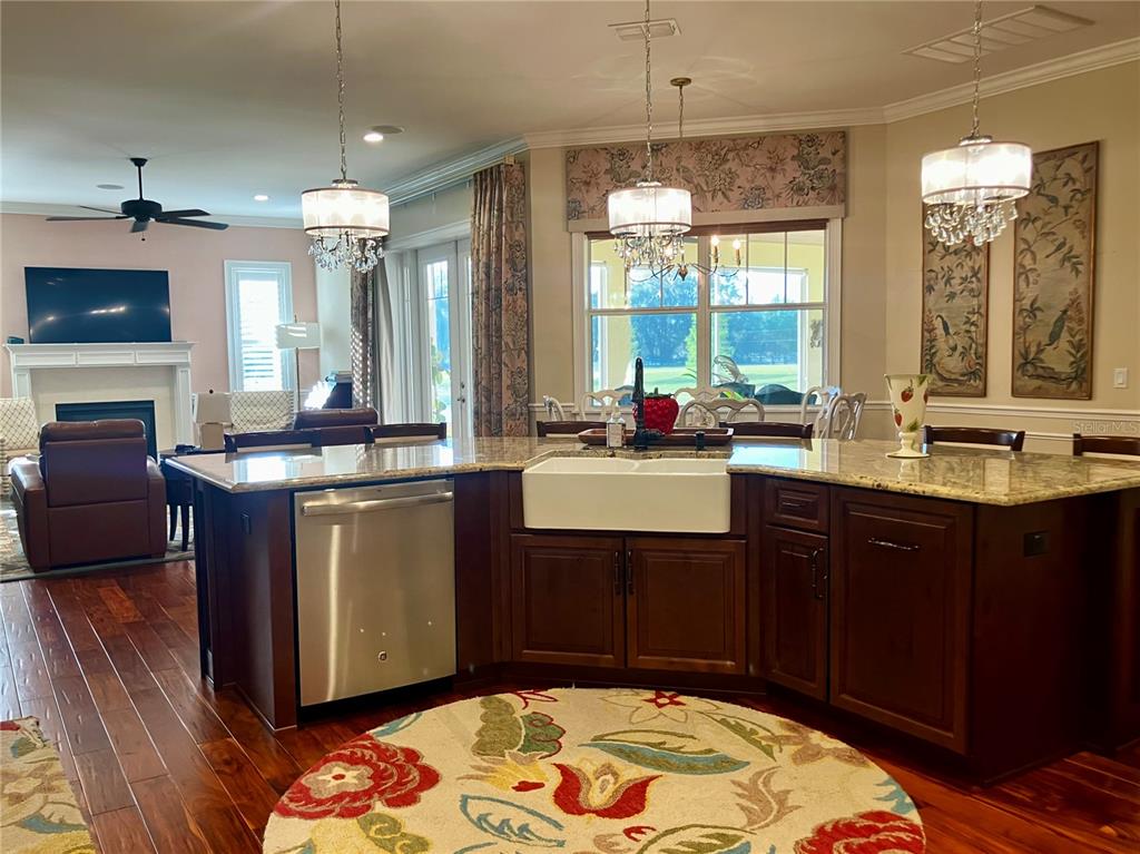 3709 Gallagher Road Plant City, FL 33565 - Photo 20 of 60 a room with a chandelier furniture a flat screen tv and a chandelier