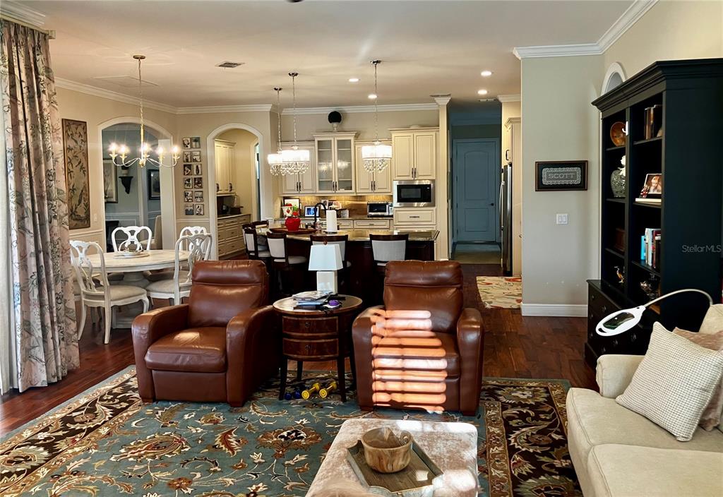3709 Gallagher Road Plant City, FL 33565 - Photo 21 of 60 a living room with furniture and wooden floor