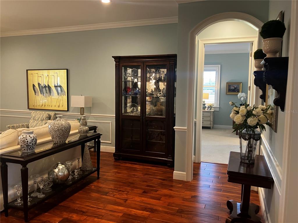 3709 Gallagher Road Plant City, FL 33565 - Photo 24 of 60 a living room with furniture and wooden floor