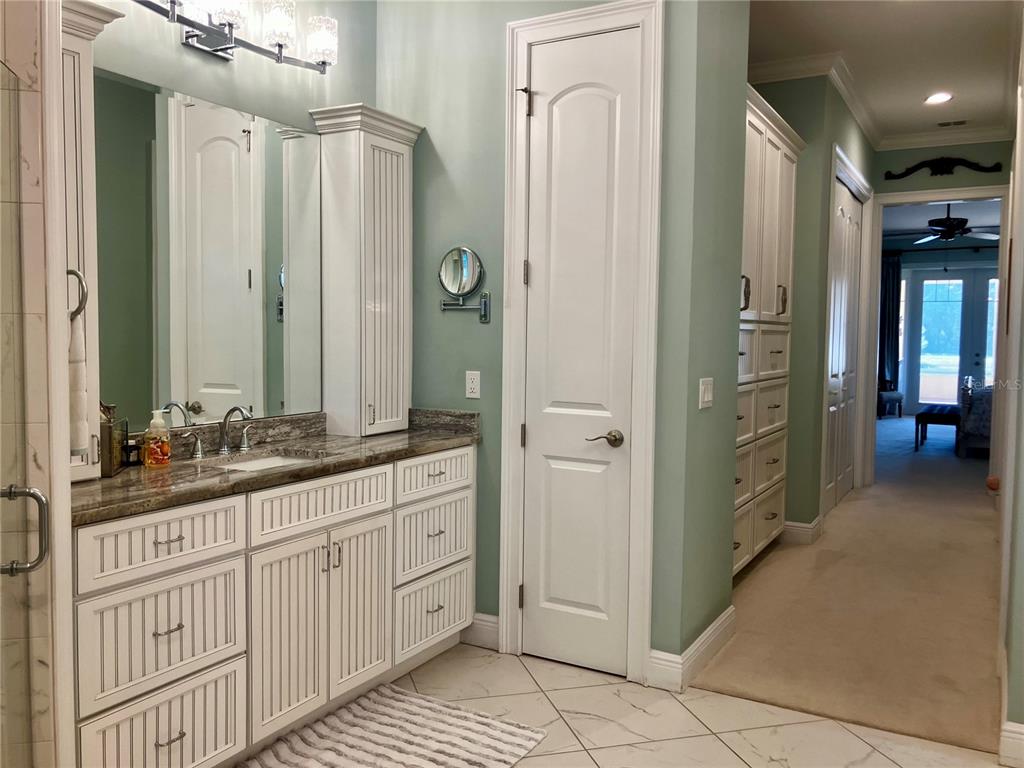 3709 Gallagher Road Plant City, FL 33565 - Photo 28 of 60 a bathroom with a double vanity sink and a mirror