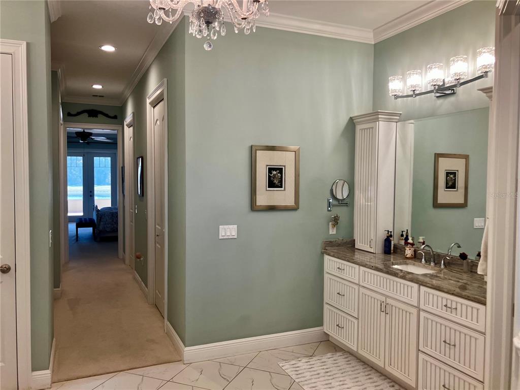 3709 Gallagher Road Plant City, FL 33565 - Photo 29 of 60 a bathroom with a double vanity sink and a mirror