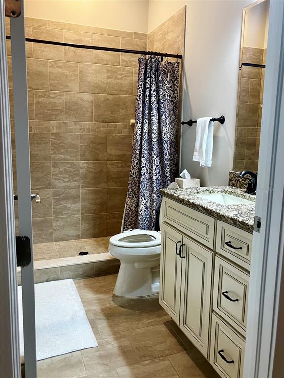 3709 Gallagher Road Plant City, FL 33565 - Photo 31 of 60 a bathroom with a sink a toilet and shower