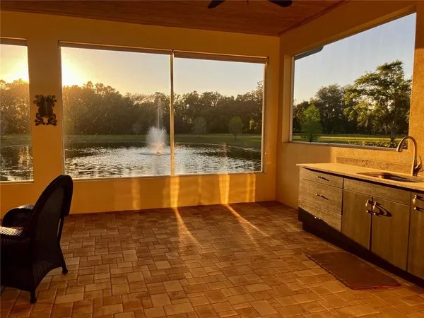 a view of swimming pool with outdoor seating