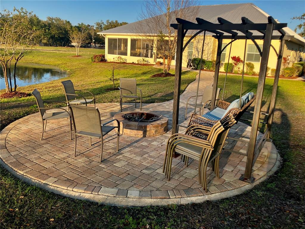 3709 Gallagher Road Plant City, FL 33565 - Photo 41 of 60 a view of swimming pool with outdoor seating